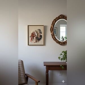 Large  framed portrait of Indigenous man in headdress Native American